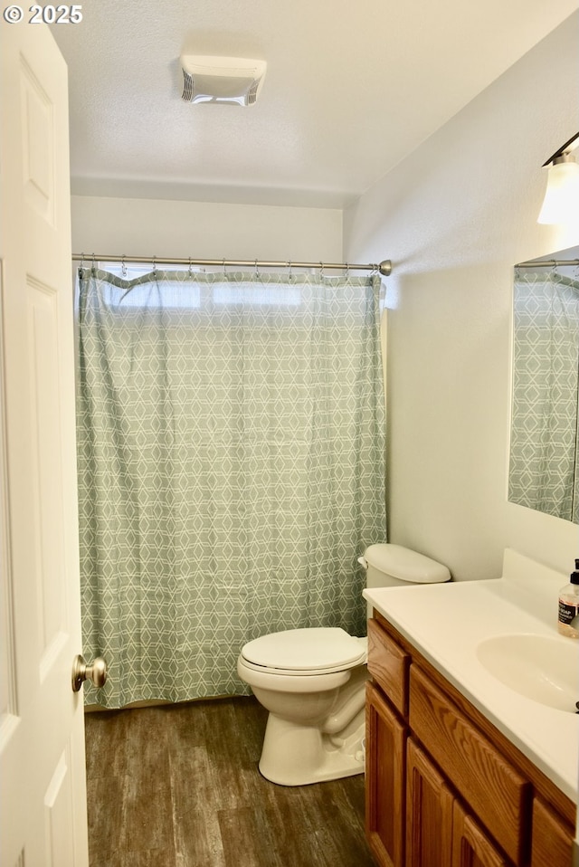 29519 Crook St, Gold Beach, OR 97444 - bathroom featuring toilet, wood finished floors, vanity, and a shower with curtain