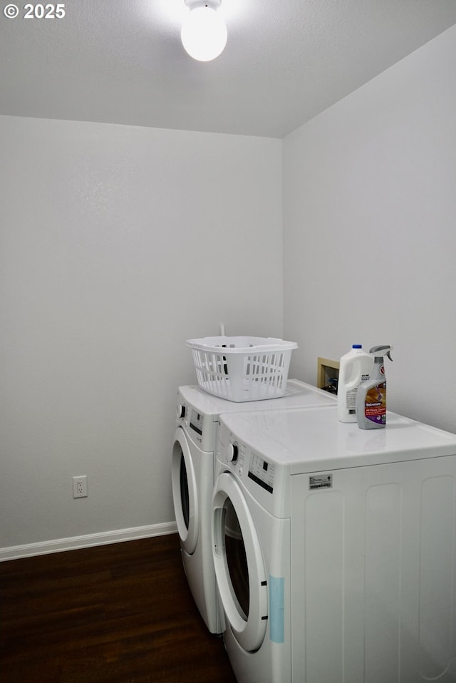 29519 Crook St, Gold Beach, OR 97444 - clothes washing area with baseboards, washing machine and dryer, laundry area, and dark wood-style floors