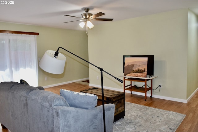 29519 Crook St, Gold Beach, OR 97444 - living area with wood finished floors, ceiling fan, and baseboards