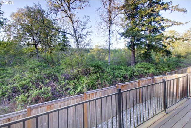 deck with a fenced backyard