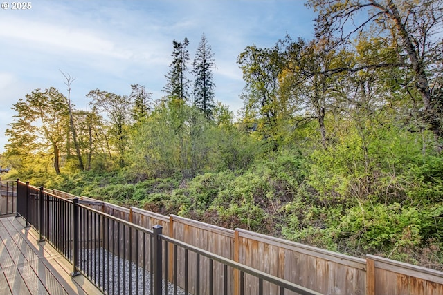 wooden deck featuring a fenced backyard
