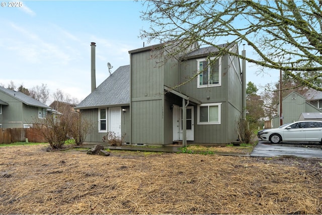 view of front of house featuring roof with shingles