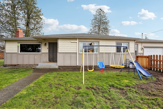 exterior space featuring a playground and a front yard