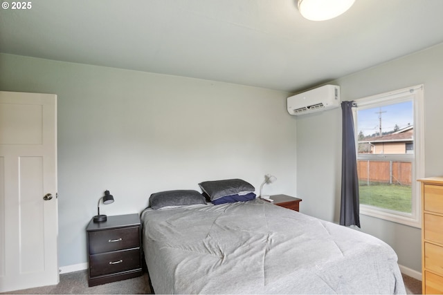 bedroom with a wall mounted air conditioner and carpet