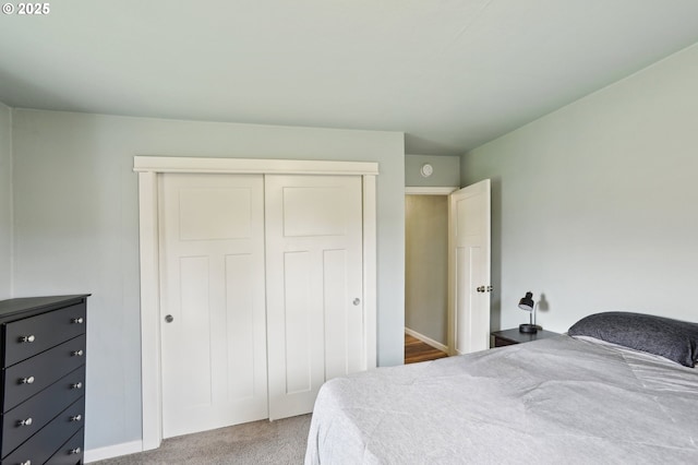 bedroom with carpet floors and a closet