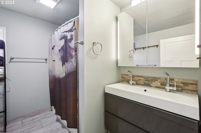 bathroom with tasteful backsplash, vanity, and a shower with shower curtain