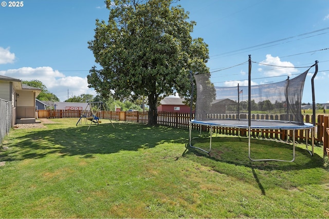 324 N 18th St, Saint Helens, OR 97051 - view of yard featuring a trampoline and a playground
