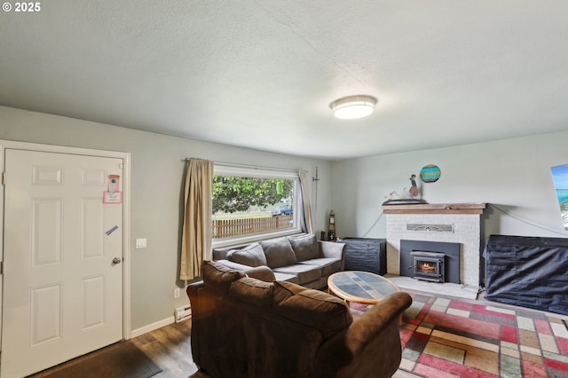 324 N 18th St, Saint Helens, OR 97051 - living area with wood finished floors, baseboard heating, a textured ceiling, and baseboards