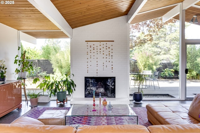 living area with lofted ceiling with beams, a fireplace, and wooden ceiling