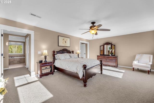 bedroom with carpet flooring, connected bathroom, and ceiling fan