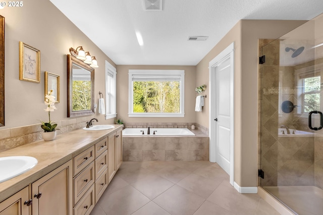 bathroom with vanity, separate shower and tub, and tile patterned flooring