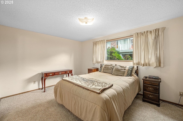 12841 SE Stark St Unit A19, Portland, OR 97233 - bedroom with light carpet, baseboards, and a textured ceiling