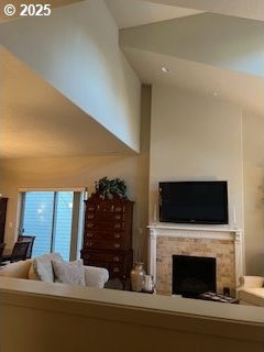 living room featuring lofted ceiling