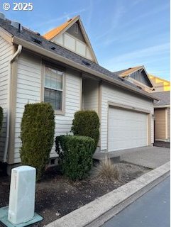 view of property exterior with a garage