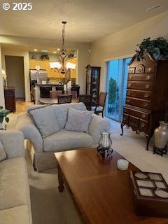 living room with an inviting chandelier