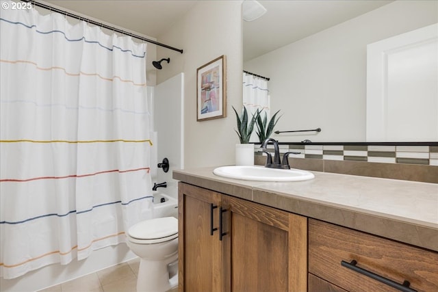 full bathroom with vanity, tile patterned floors, toilet, and shower / bath combo