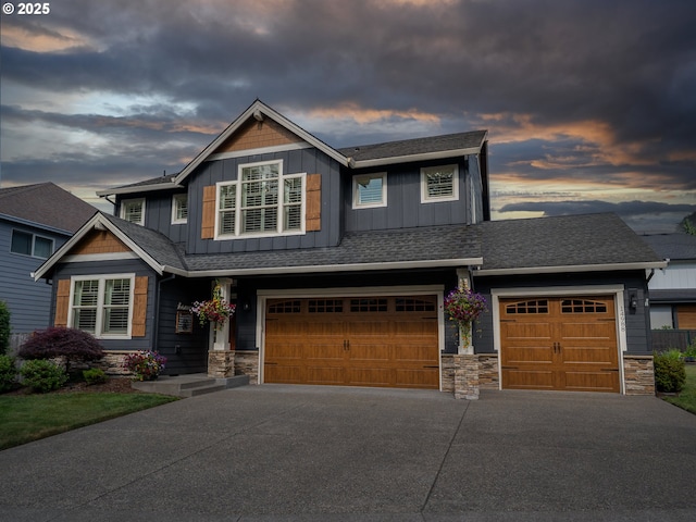 14988 SE Glenbrook Rd, Clackamas, OR 97015 - craftsman-style home with stone siding, board and batten siding, driveway, a garage, and a shingled roof