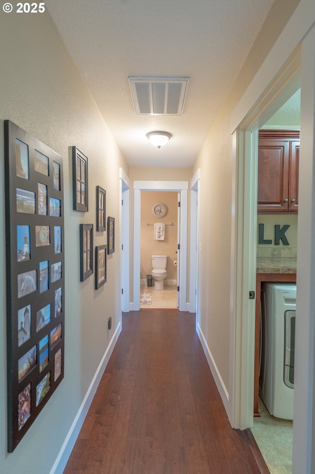 14988 SE Glenbrook Rd, Clackamas, OR 97015 - hall with washer / clothes dryer and dark wood finished floors
