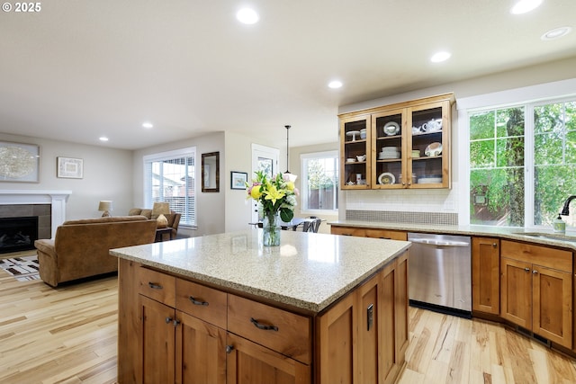 11862 White Ln, Oregon City, OR 97045 - kitchen featuring stainless steel dishwasher, a sink, light wood-style floors, a center island, and recessed lighting