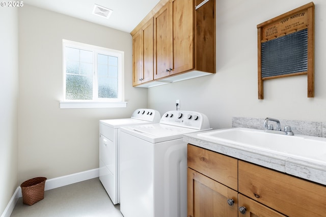 11862 White Ln, Oregon City, OR 97045 - laundry area featuring washer and dryer, cabinet space, and baseboards