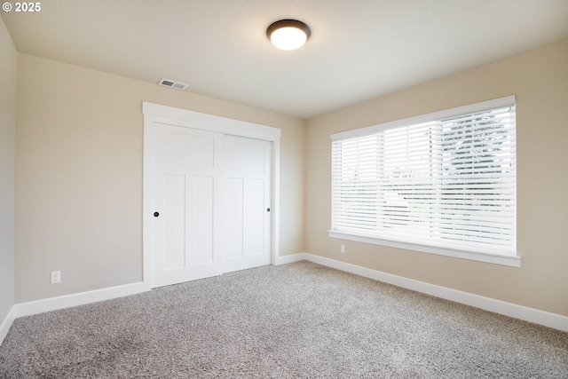 11862 White Ln, Oregon City, OR 97045 - unfurnished bedroom with baseboards, carpet, and a closet