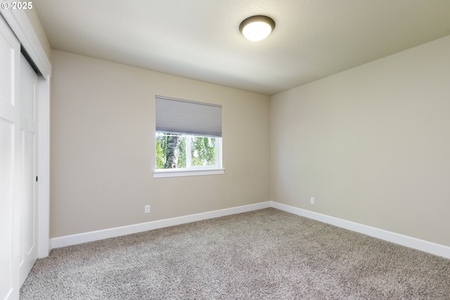 11862 White Ln, Oregon City, OR 97045 - unfurnished bedroom with a closet, carpet floors, and baseboards