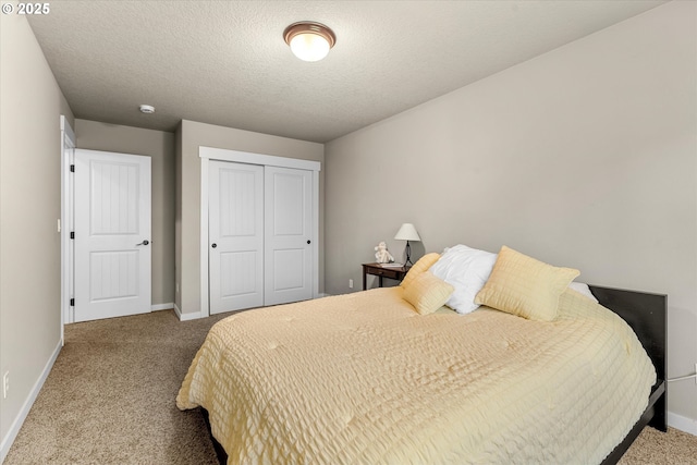 18289 SW Maidenfern Ln, Sherwood, OR 97140 - bedroom with carpet, baseboards, a closet, and a textured ceiling