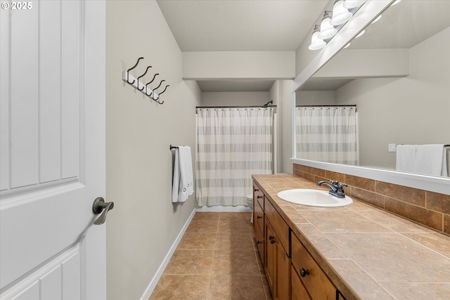 18289 SW Maidenfern Ln, Sherwood, OR 97140 - full bath featuring vanity, backsplash, baseboards, tile patterned floors, and a shower with curtain