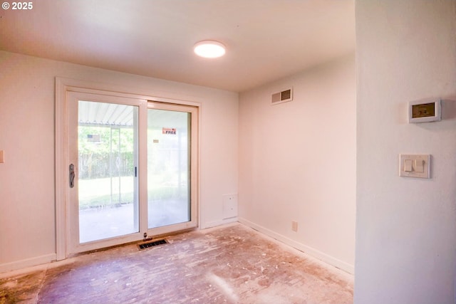unfurnished room featuring baseboards