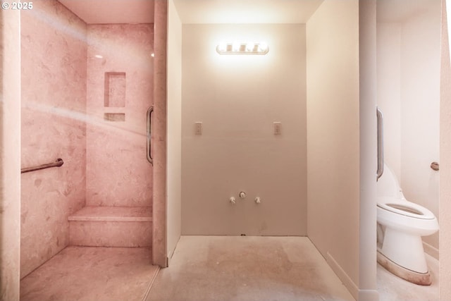 bathroom with toilet and a shower