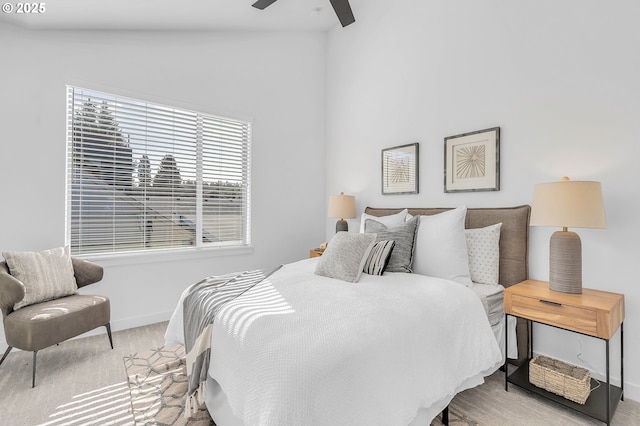 bedroom with a ceiling fan, baseboards, and carpet floors