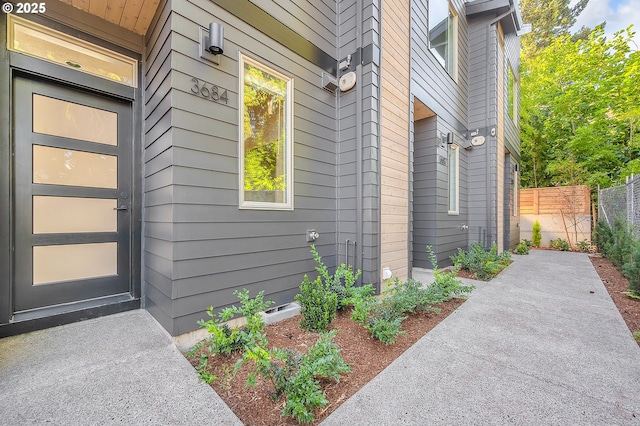 property entrance featuring fence