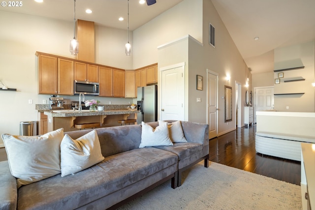 8996 SE Chloe Ln, Happy Valley, OR 97086 - living room with high vaulted ceiling, dark wood-type flooring, baseboards, recessed lighting, and ceiling fan