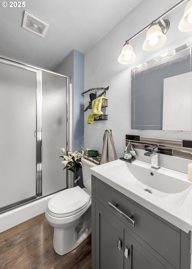 14805 SW 109th Ave, Portland, OR 97224 - full bathroom with vanity, toilet, wood finished floors, and a stall shower