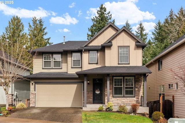 view of front of home featuring stone siding, roof with shingles, board and batten siding, and driveway