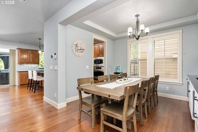 kitchen with white cabinetry, beverage cooler, dark wood-style flooring, and a sink