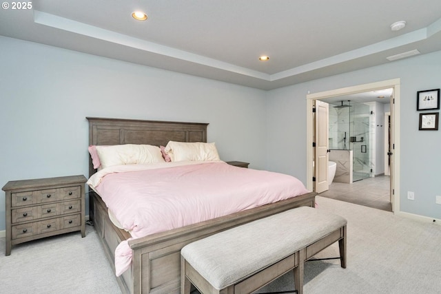 bedroom featuring a tray ceiling, recessed lighting, light colored carpet, and baseboards