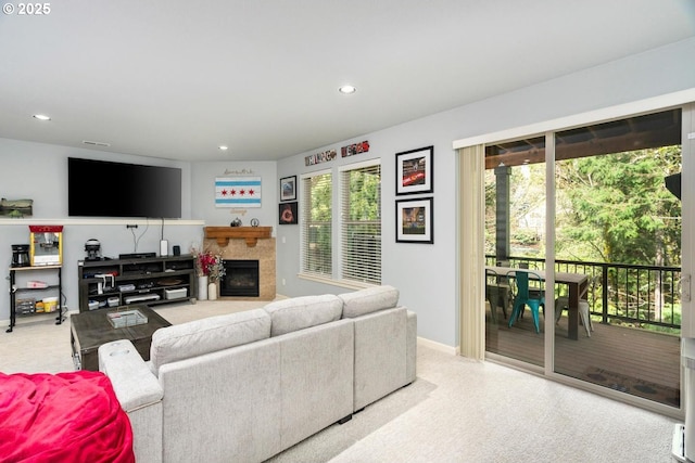 living area with recessed lighting, baseboards, and a fireplace