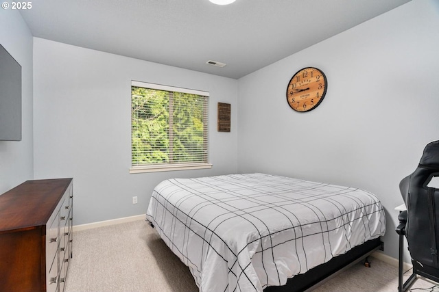 bedroom featuring visible vents, carpet flooring, and baseboards