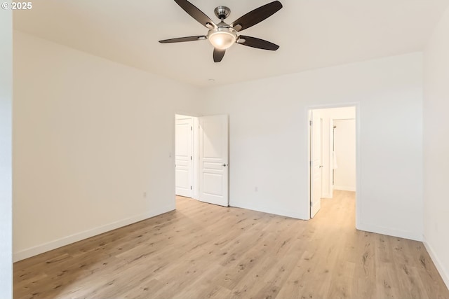 unfurnished bedroom with light wood finished floors, baseboards, and a ceiling fan