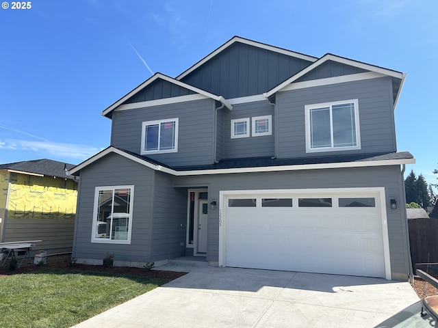 12205 NE 107th Way, Vancouver, WA 98682 - view of front of house with board and batten siding, a garage, and driveway