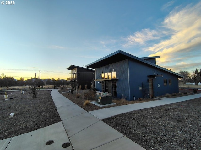 view of property exterior at dusk