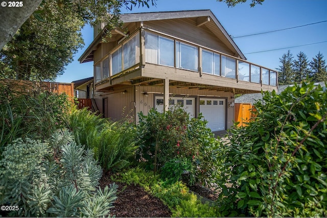 605 SE 2nd St, Newport, OR 97365 - view of front facade with a garage
