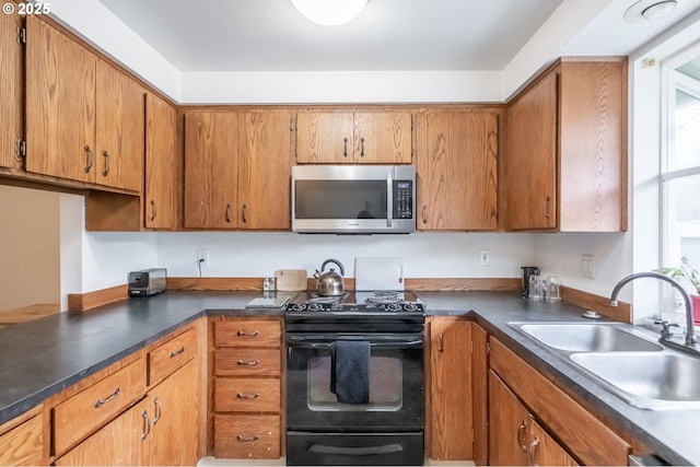 kitchen featuring sink and black electric range