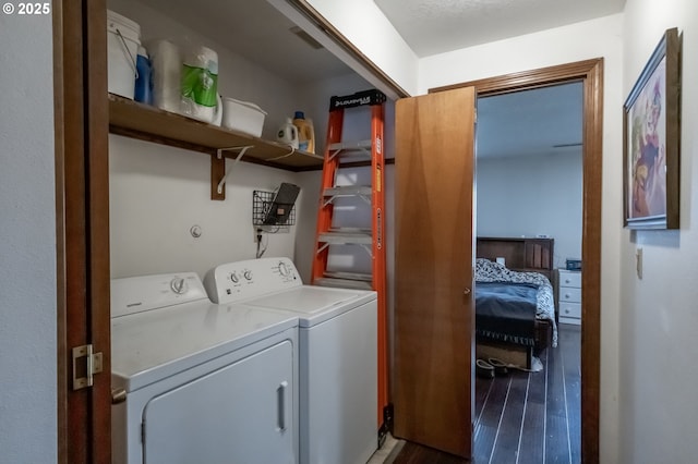 washroom with hardwood / wood-style floors and independent washer and dryer