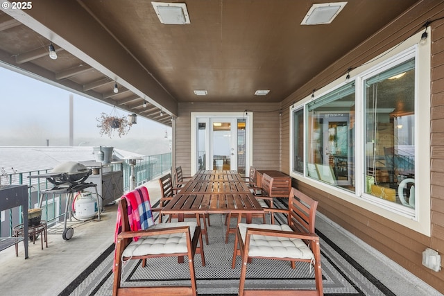 view of patio featuring a balcony