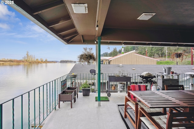 view of patio / terrace with a water view