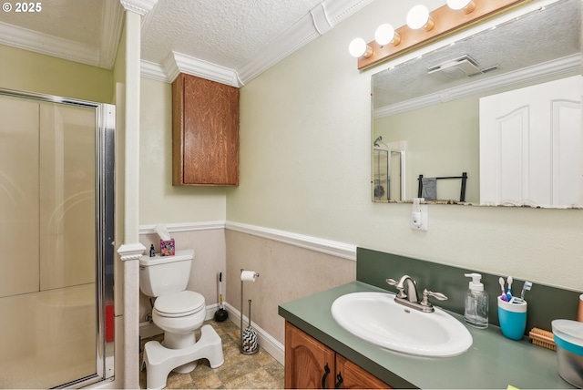 bathroom with crown molding, a shower with door, and a textured ceiling