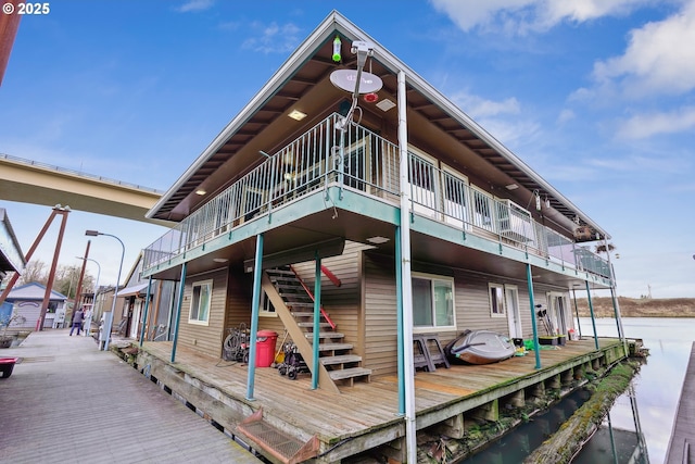 rear view of property with a water view