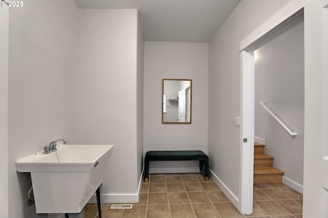 bathroom with tile patterned flooring and sink